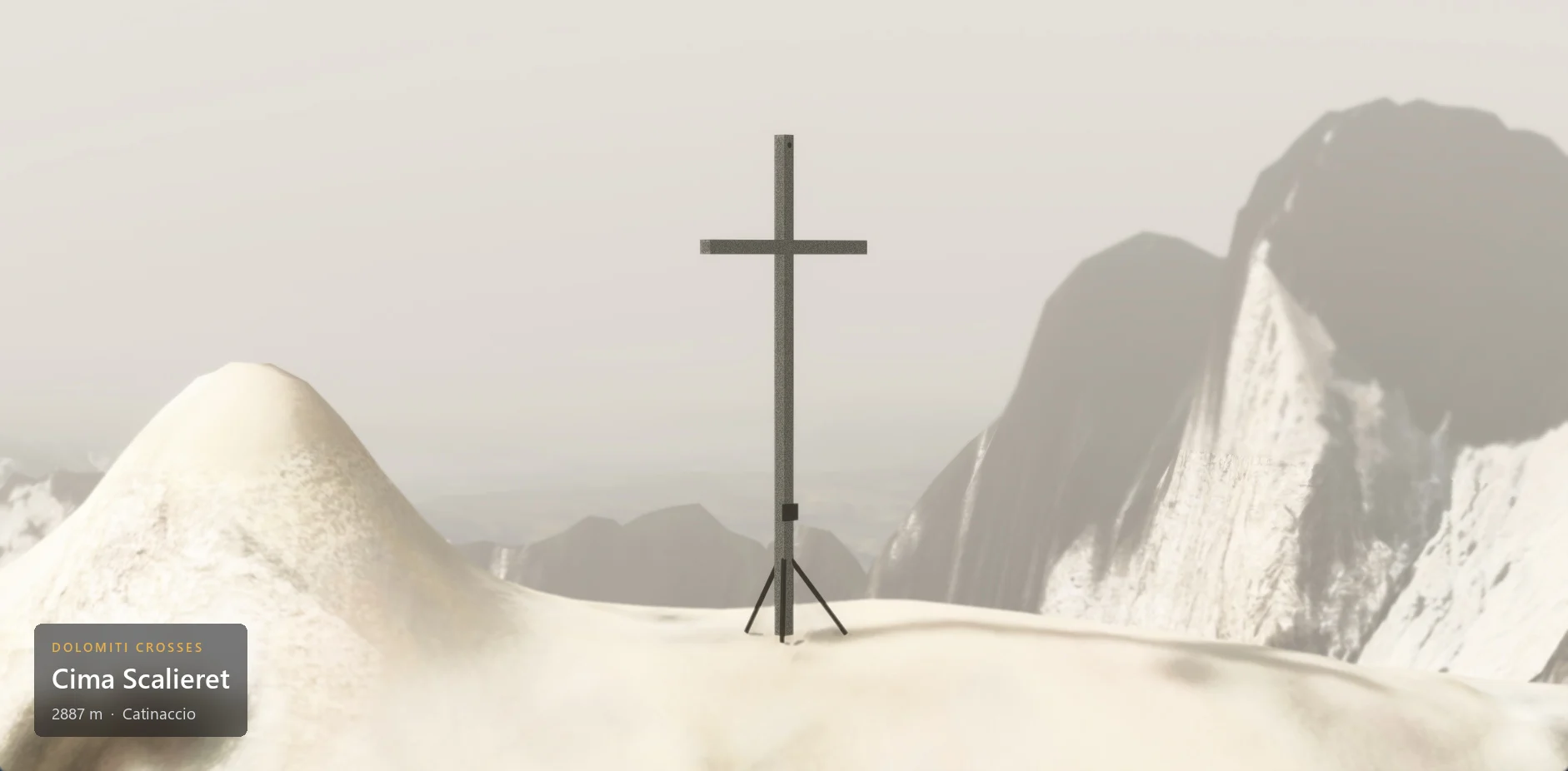 The summit cross on Cima Scalieret (2887 m) seen from the side, in hazy overcast weather, with the caption plate in the lower left corner.