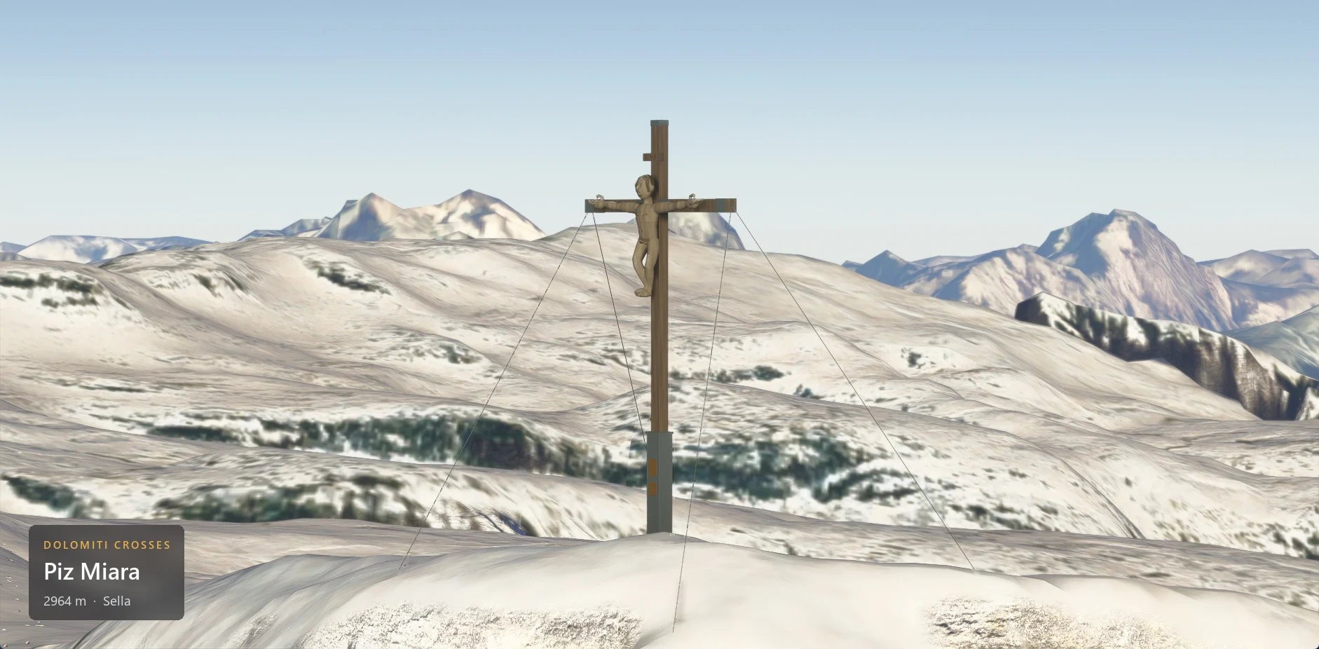 The summit cross on Piz Miara (2964 m) seen from the side, with the caption plate in the lower left corner.