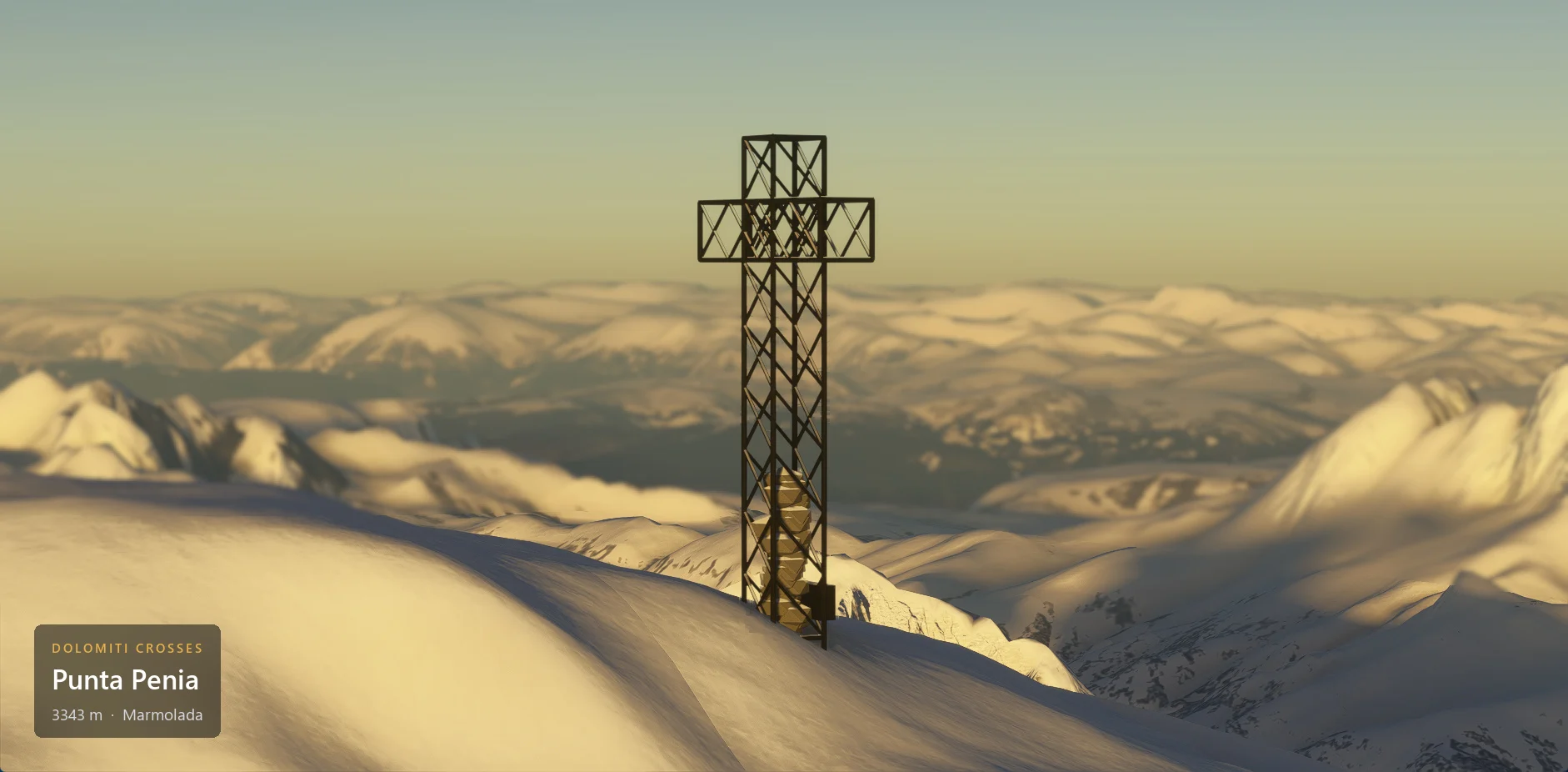 The summit cross on Punta Penia (3343 m) seen from the side, with winter snow, with the caption plate in the lower left corner.