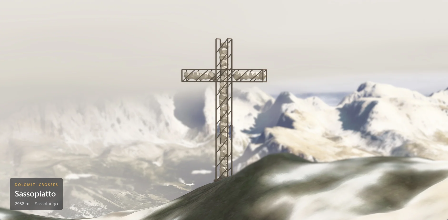 The summit cross on Sassopiatto (2958 m) seen from the side, in hazy overcast weather, with the caption plate in the lower left corner.